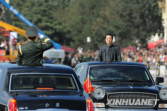 President rides Red Flag limo reviewing parade troops