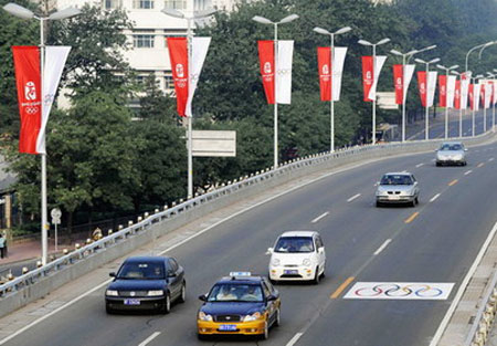 Fewer cars push Beijing Olympics to green lane
